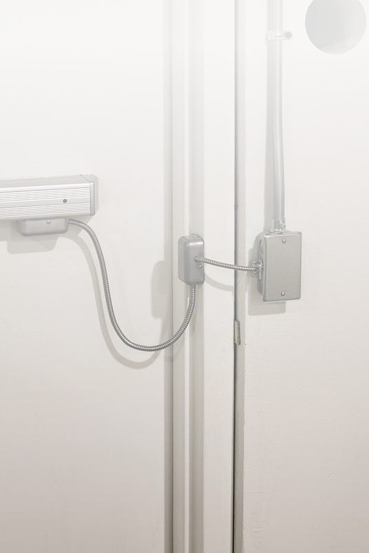 Low voltage access control reader (mobile) Wall-mounted access control reader installed by an Elson Electric low voltage crew