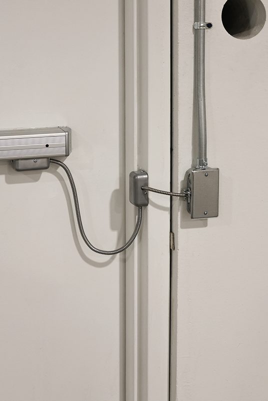 Low voltage access control reader Wall-mounted access control reader installed by an Elson Electric low voltage crew