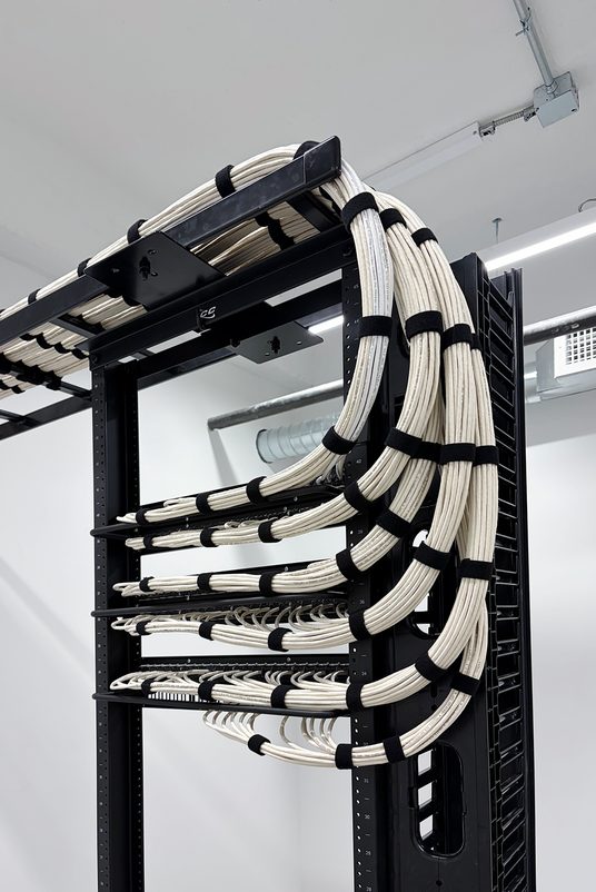 Low voltage structured cabling rack Organized structured cabling rack with labeled patch panels